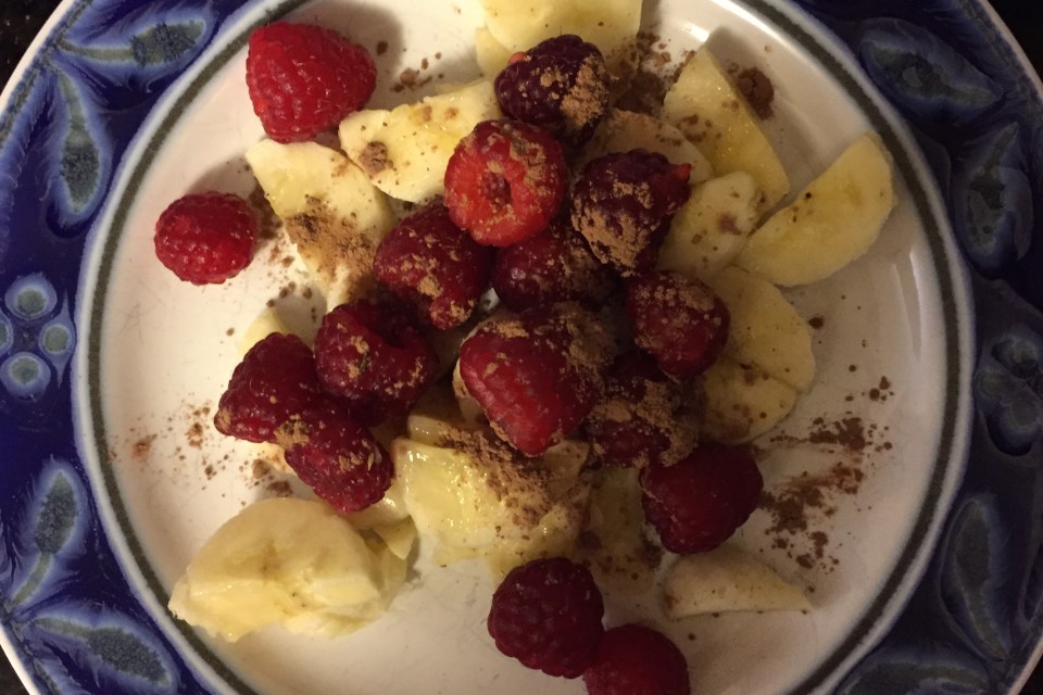 Berries dessert with cocoa powder