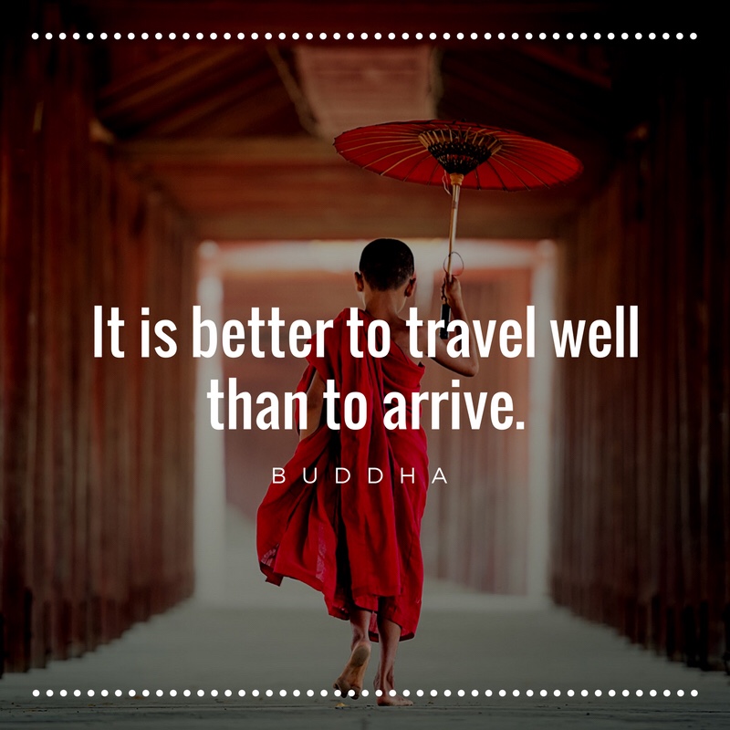 Image of young Buddha monk with umbrella