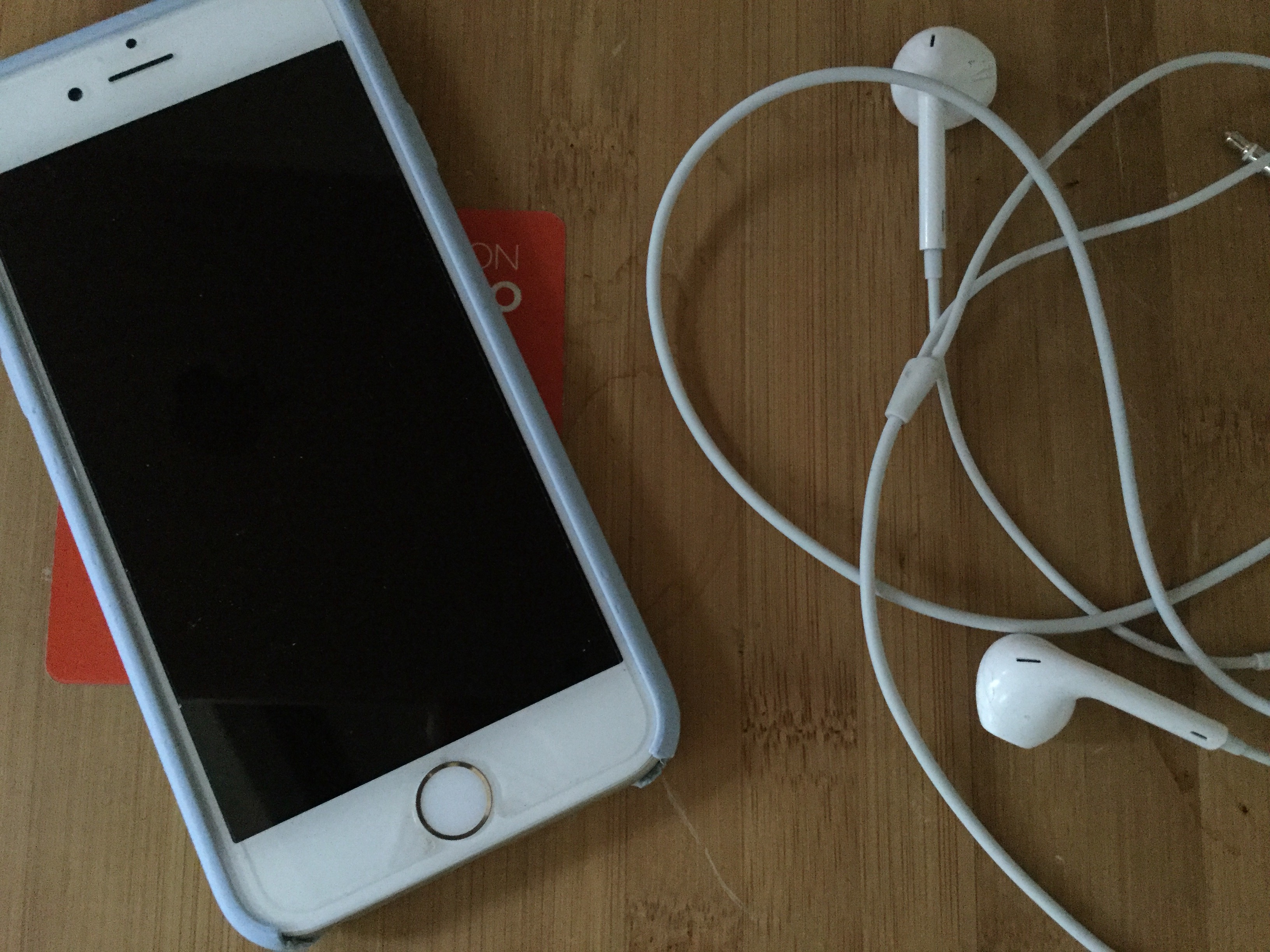 Image of iPhone and earbuds