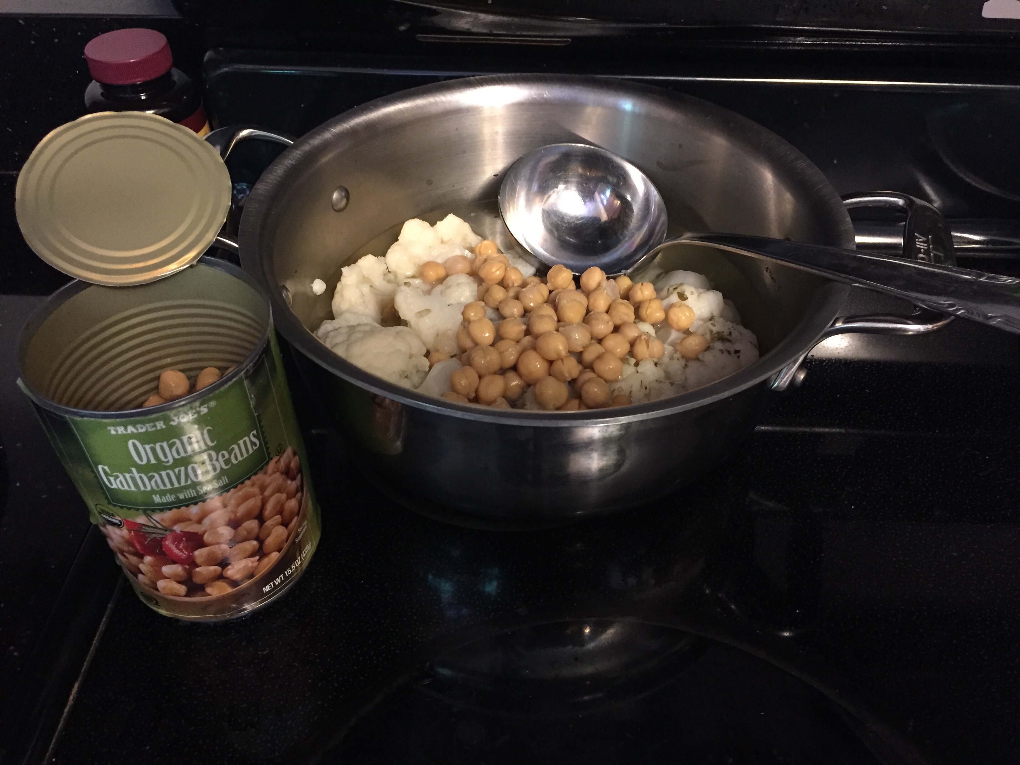 Cauliflower and chickpeas in sauce pan