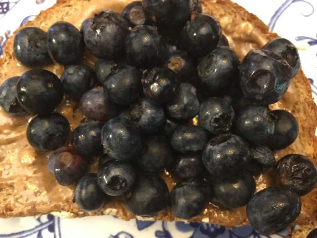 Sprouted-grain toast with almond butter and&nbsp;blueberries