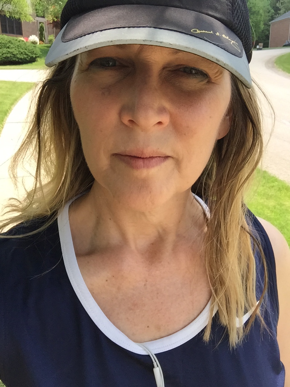 Author outdoors wearing a hat 