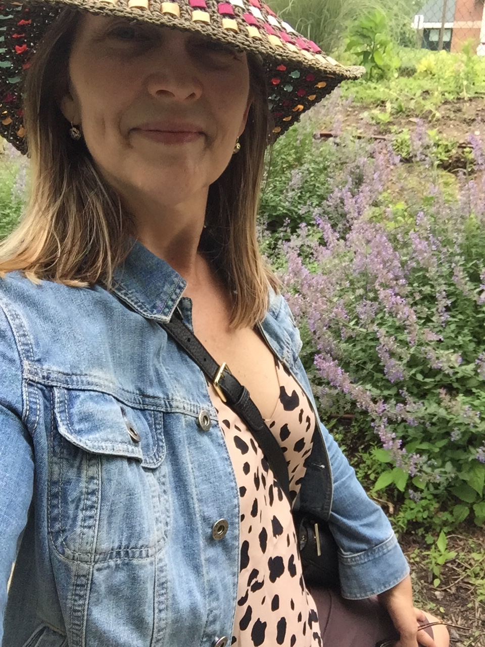 Author in front of garden