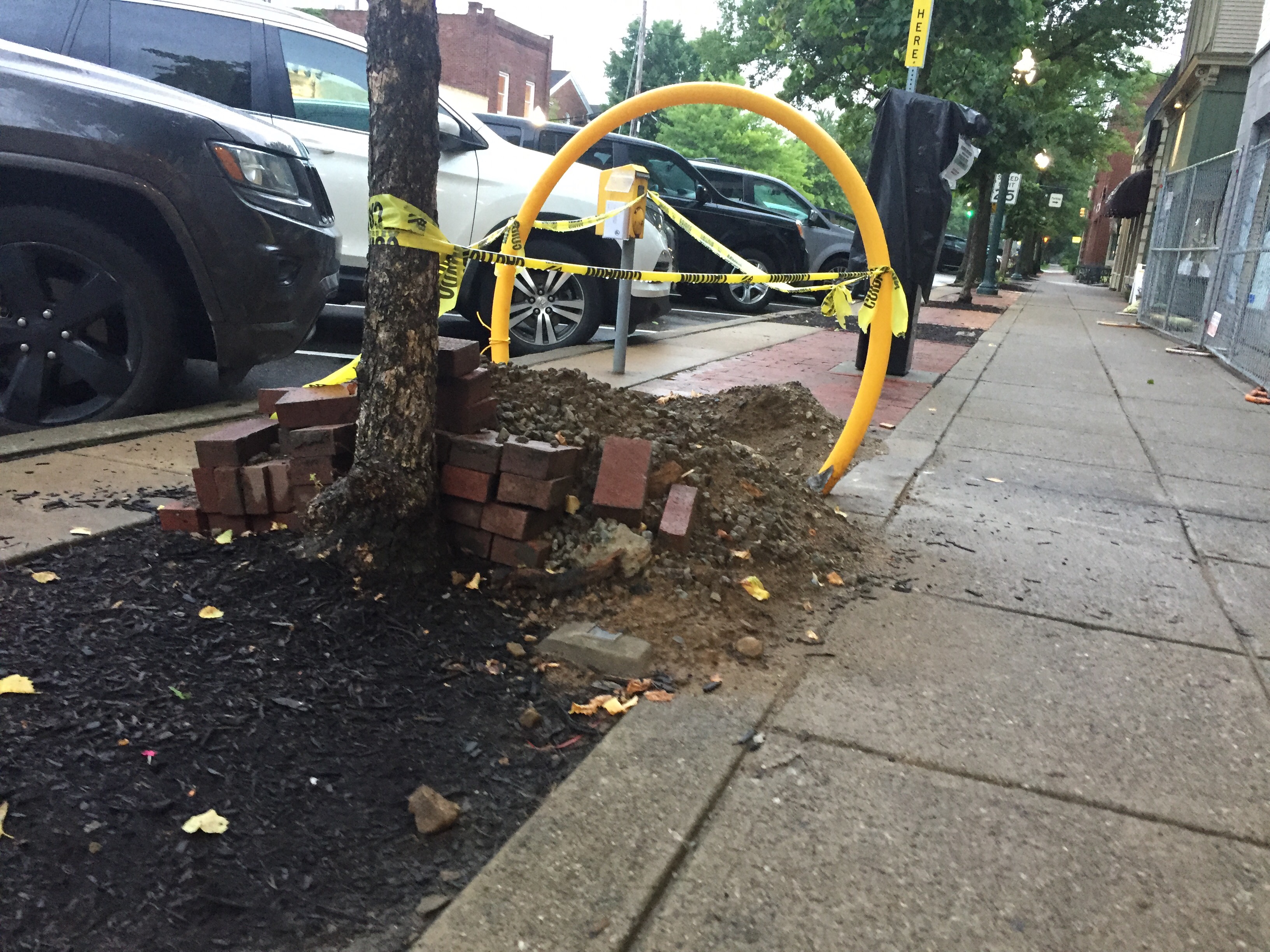 Yellow construction caution ring and tape