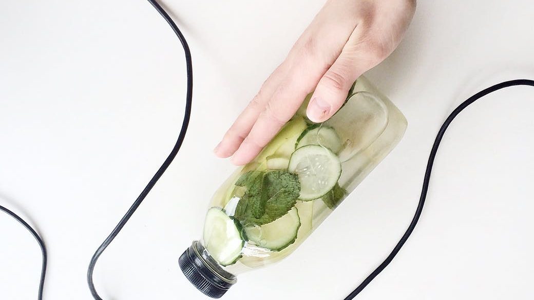 photo of cucumber water in a bottle