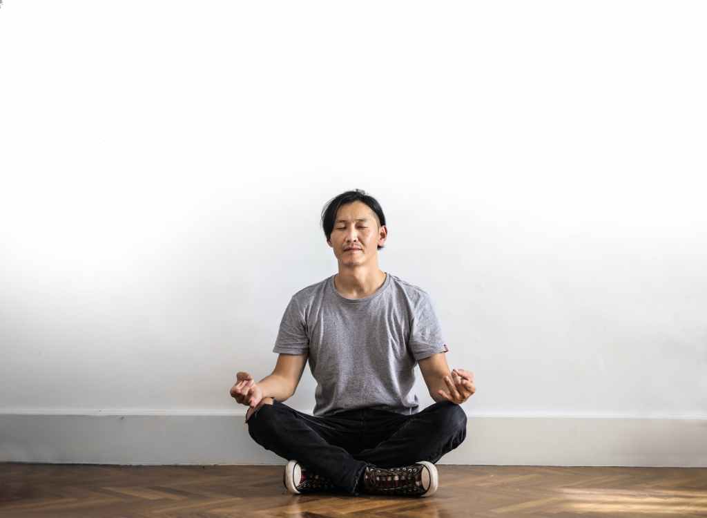 photo of man meditating. Photo credit: Photo by Andrea Piacquadio 